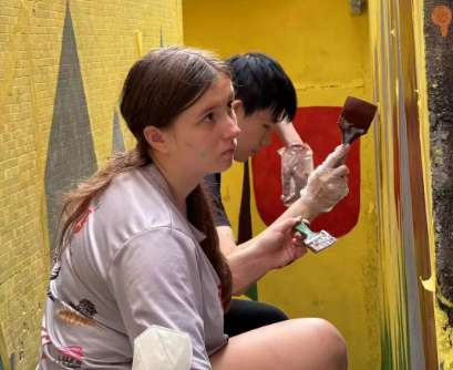 Intl. volunteers brighten community with child-friendly murals